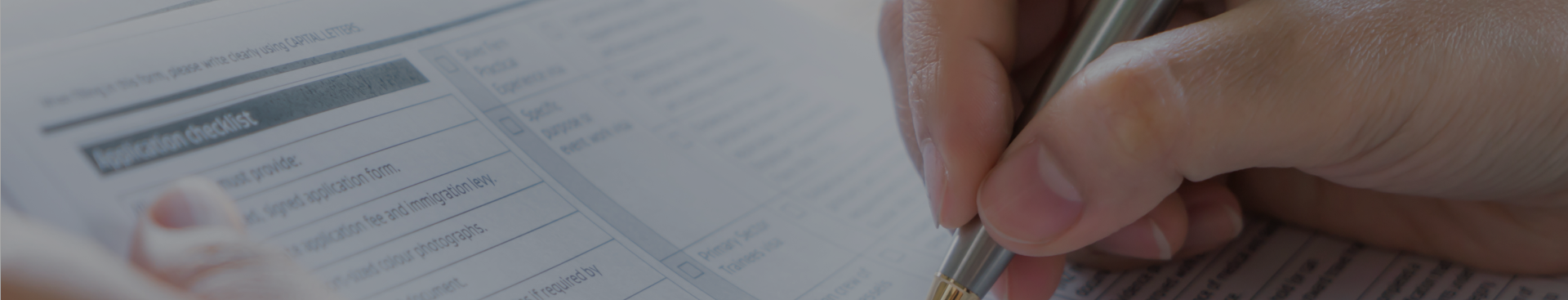a-hand-filling-out-the-document